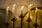 Golden candelabrum or candle chandelier with light candles. Traditional antique lighting system