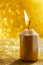 Golden candles. Gold glittering christmas lights. Blurred abstract background
