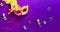 Golden Carnival mask on purple background with sparkles. Mardi gras concept. Copy space