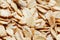 Golden cereal muesli, background and texture. Oatmeal grains. Healthy breakfast Top view. Close-up