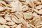 Golden cereal muesli, background and texture. Oatmeal grains. Healthy breakfast Top view. Close-up