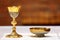 Golden chalice on the altar during the mass