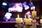 Golden chandeliers with lighted candles on blurred background
