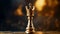 Golden chess piece with a crown on top