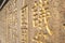 Golden Chinese Characters Carved on Stone Wall