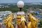 Golden Chinese dragon statues decorate the lamp on the rooftop