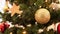 Golden christmas ball decoration on fir tree