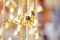 Golden christmas bells hanging as new year toys defocused background