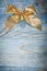 Golden Christmas knot on wooden board top view celebrations conc