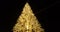 Golden christmas tree on night sky, holiday and festive