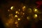 Golden circular reflections christmas lights black background
