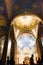 Golden classic church ceiling with a chandelier and an altar, Jerusalem Gethsemane