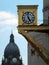 The golden clock on leeds civic hall with the dome of the town hall in the background