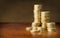 Golden coins stacks on table background