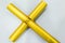 Golden color cross on white background closeup view