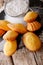 Golden Cookie shell Madeleine close-up on the table. Vertical, r