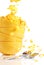 Golden cornflakes falls into the bowls