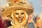 Golden costumed masked woman