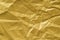 Golden creased paper texture background