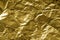 Golden creased paper texture background