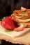 Golden crepes piled on a wooden board