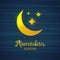 Golden crescent on a blue background. Yellow moon for Ramadan. Card for Ramadan. Card, banner with a crescent gold moon