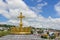 Golden cross and crown in Lourdes, France, Hautes Pyrenees. Basilica of our Lady of the Rosary