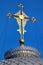 Golden cross on metal dome roof of an orthodox church, Ukraine