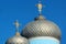 Golden crosses on metal dome roofs of an orthodox church, Ukraine