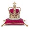 Golden crown on red velvet pillow for coronation. Royal symbol of british UK monarchy