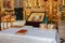 Golden crowns and bible and wedding ring on altar in church at w