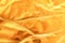 Golden crumpled fabric texture