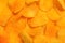 Golden crunchy paprika chips, food background, close up