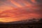 Golden dawn sunlight illuminates snowy mountain peaks