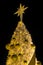 The golden decorated Christmas trees with lights star
