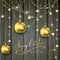 Golden decorations and Christmas balls on black wooden background