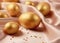 Golden decorative Easter eggs on a background of creamy shiny natural fabric. Soft texture concept. Champagne silk fabric