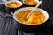 Golden delicious gratin made of potatoes, sour cream, onions and cheddar cheese close-up in a pan. horizontal