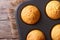 Golden delicious muffins in baking dish macro horizontal top vie