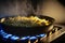 golden delicious scrambled eggs sizzling on a gas stove (AI Generated)