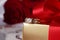 Golden diamond ring with gift box and red rose