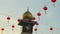Golden dome clock tower with red lanterns