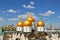 Golden domes of Cathedrals of Moscow Kremlin on blue sky background