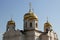 Golden domes of the Orthodox Church against the blue sky