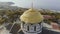 Golden domes of the Orthodox Vladimir Cathedral in Chersonesos, on the background of blue sea. Shot. The largest temple