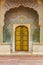 Golden door of the Peacock Gate at the city palace in Jaipur