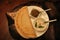 Golden dosa served on white plate with coconut chutney and mint coriander chutney.