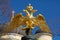 Golden double-headed eagle on a background of blue sky