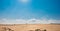 golden dunes, beach in tampico mexico, two 4x4 vehicles cross the sand on a sunny blue sky day