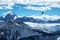 Golden eagle flying in front of swiss alps scenery. Winter mountains. Bird silhouette. Beautiful nature scenery in winter.